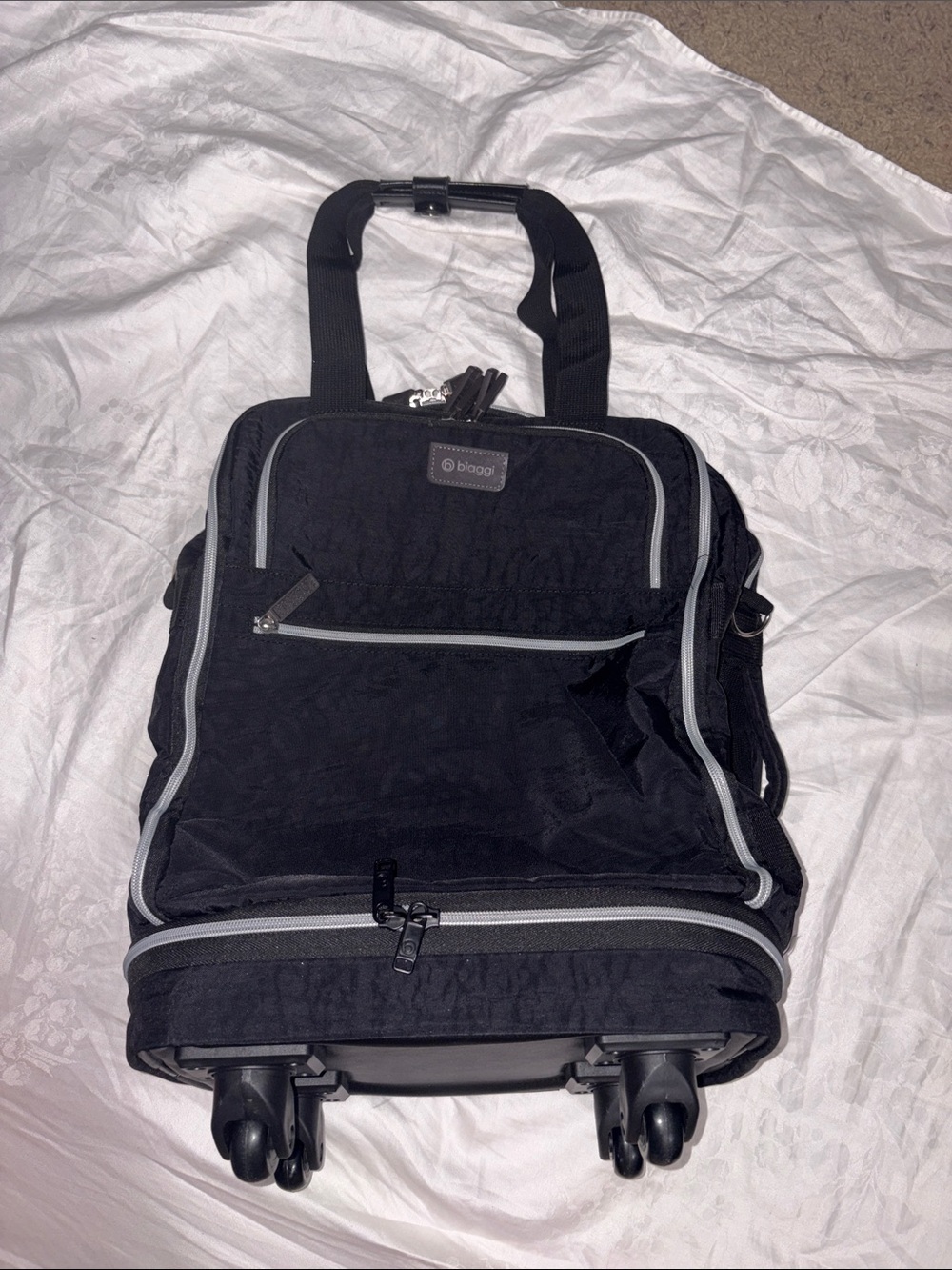 Like new Biaggi zipsak boost Underseater black rolling luggage